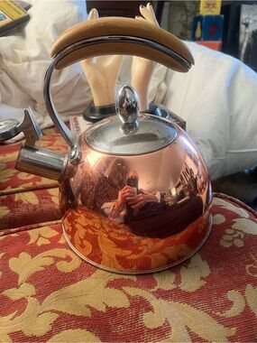 Copper Whistling Tea Kettle with Wood-Tone Handle - pinky up